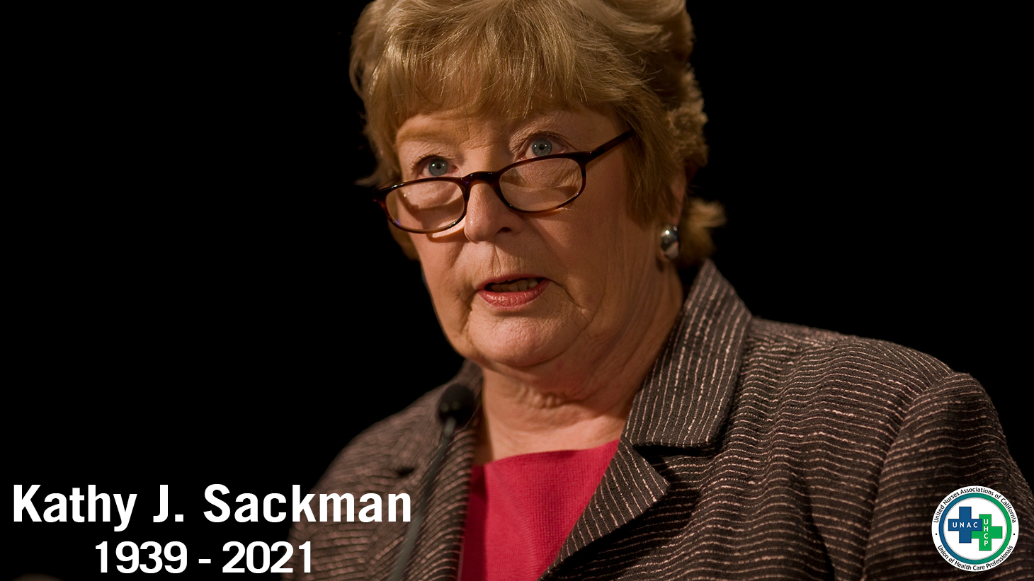 Portrait of Kathy Sackman, speaking at a conference