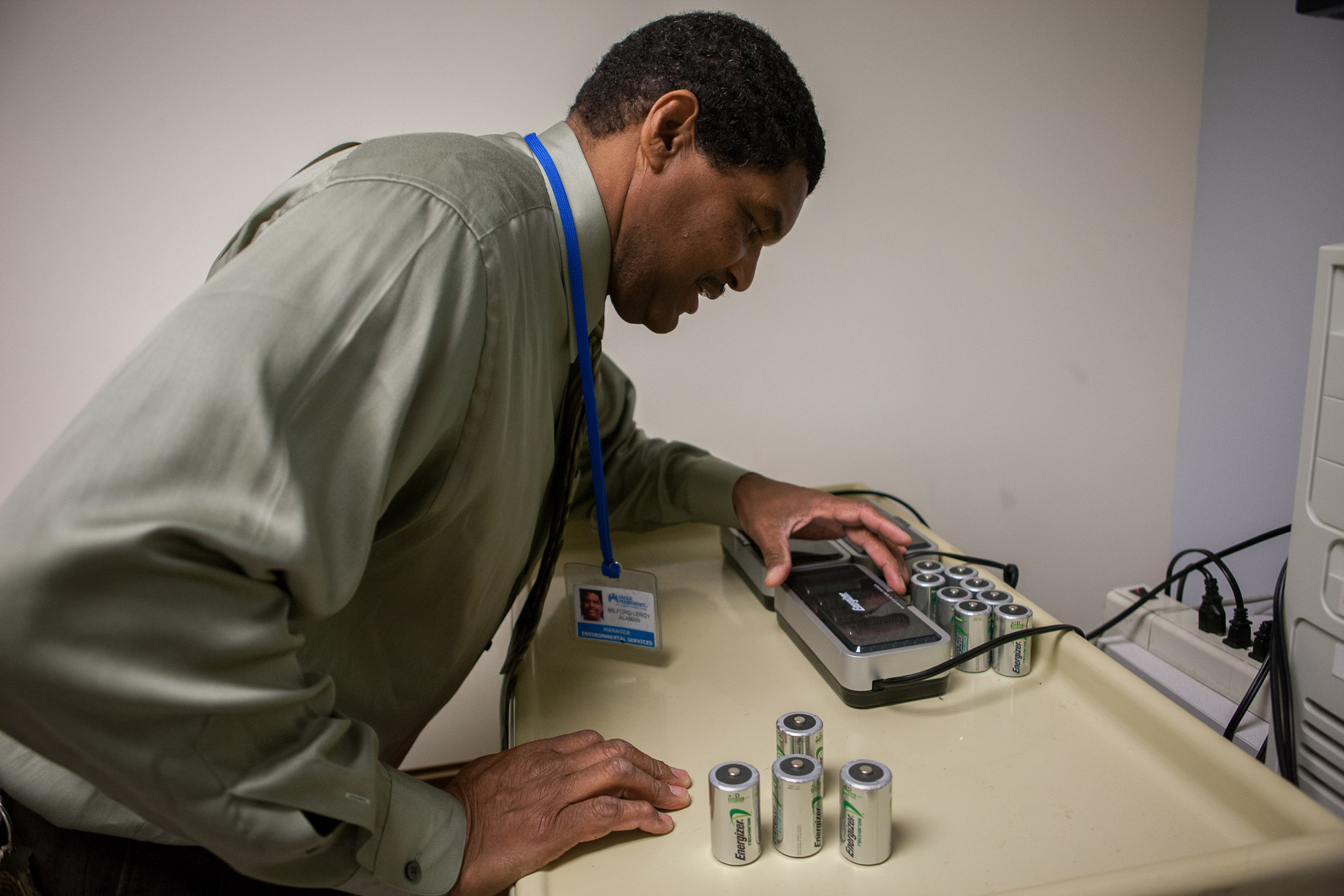 man with battery recycling device 